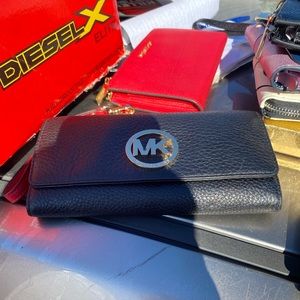 Disney leather wallet and a black micheal kors, wallets